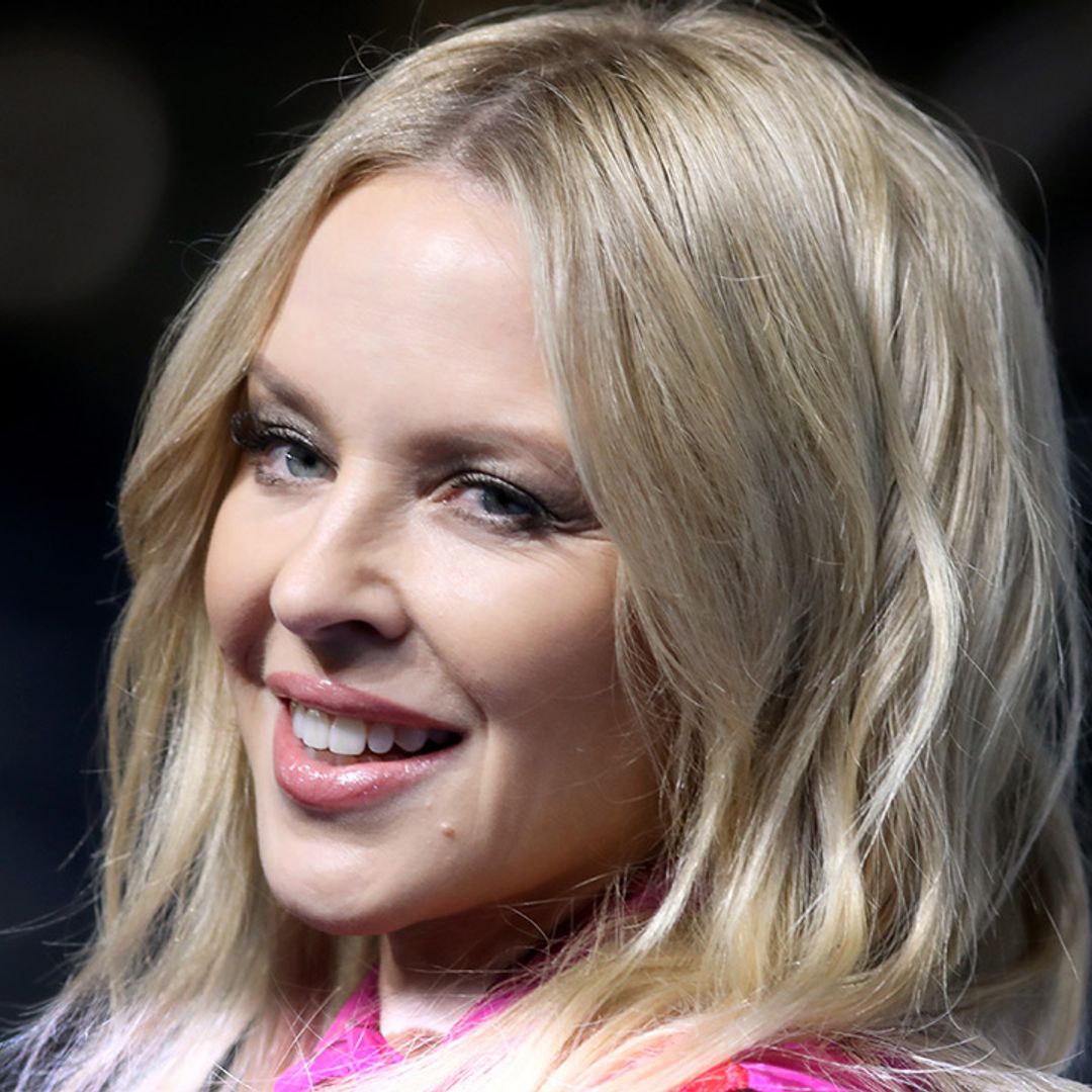 Kylie Minogue is a vision in striking denim mini-dress