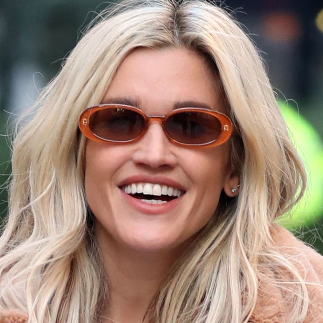 Ashley Roberts colour-clashes her pink River Island cardigan with green heels
