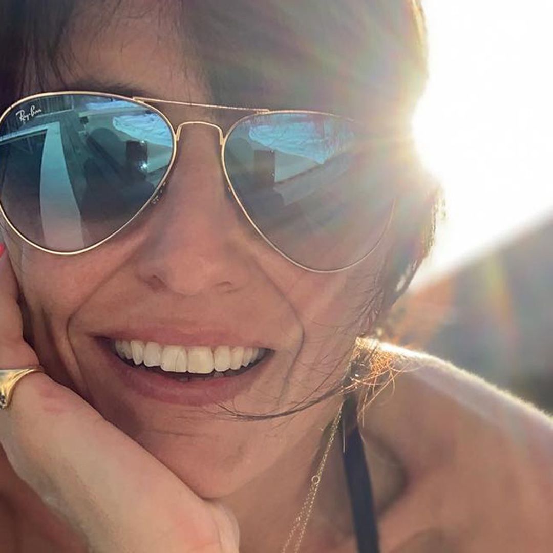 Davina McCall sparks reaction in plunging black playsuit on family holiday