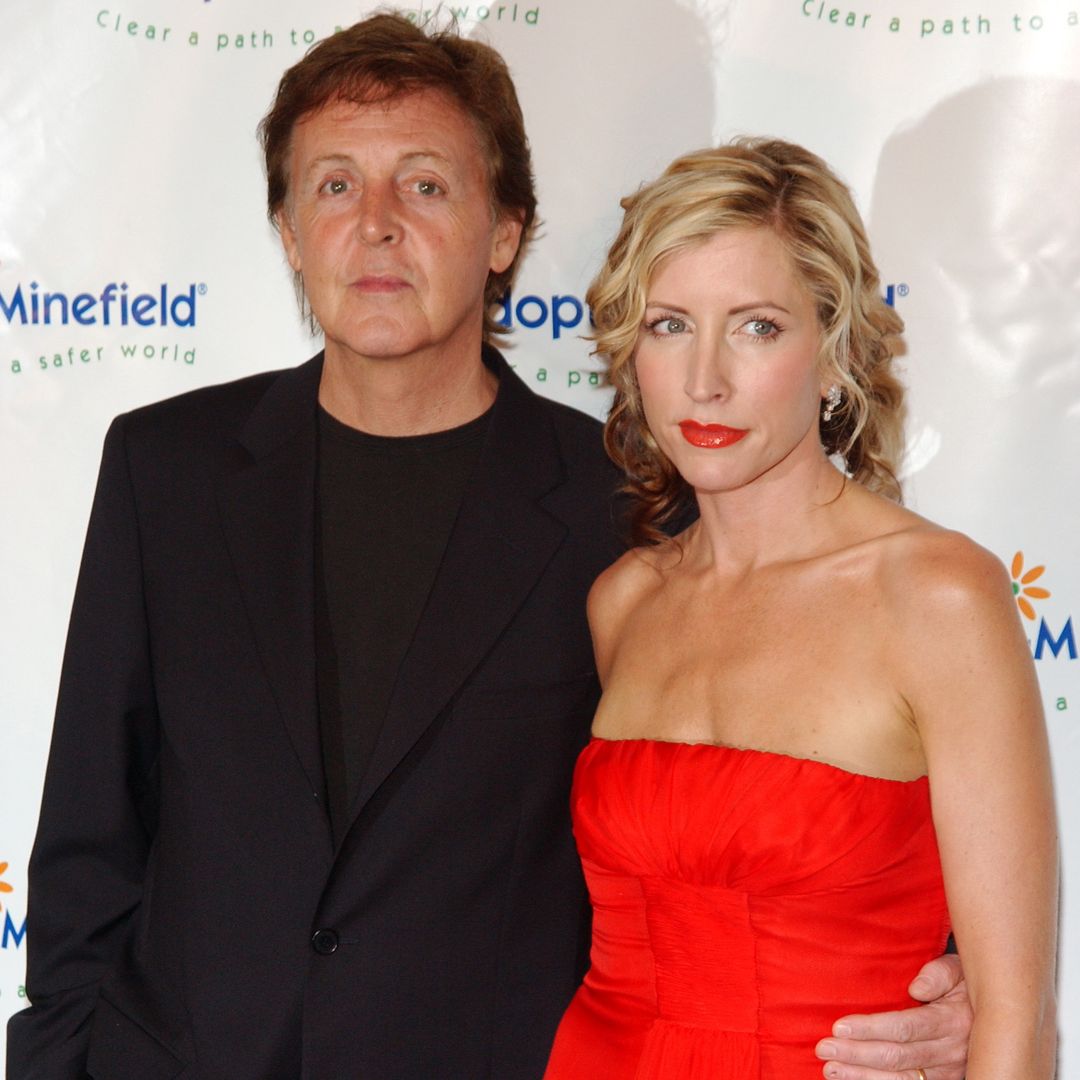 Paul McCartney and Heather Mills McCartney posing for photos on a red carpet