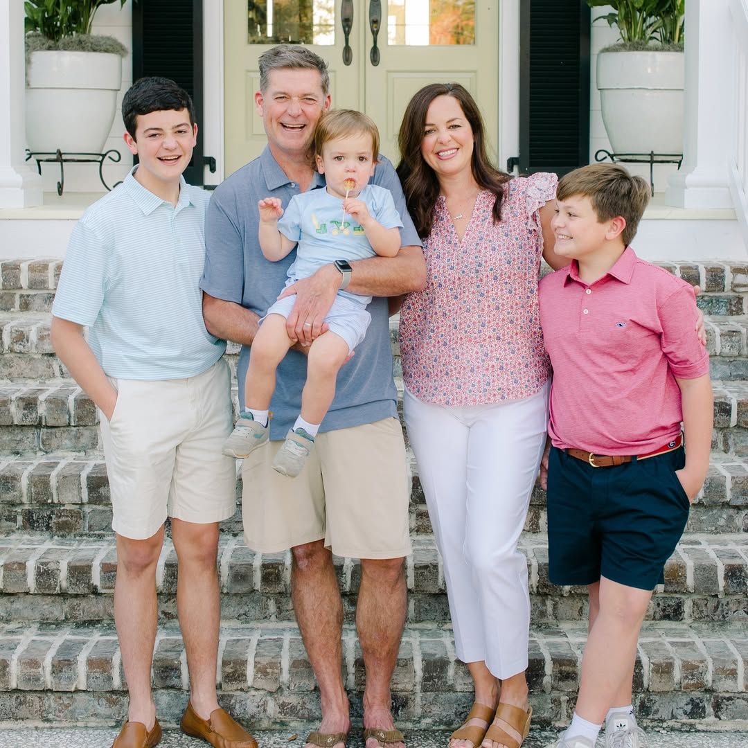 Jamie Deen, his wife Brooke and their three sons pose for a family portrait outside their home, shared on Instagram