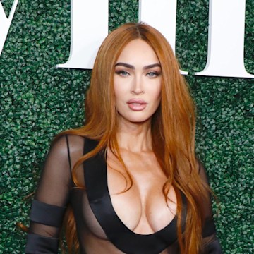 Megan Fox showcases her curves in a plunging corset covered in