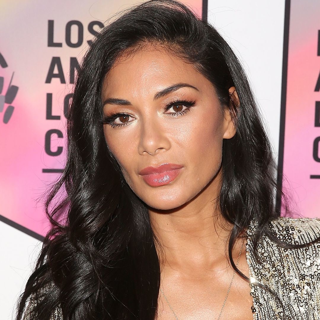Nicole Scherzinger's legs go on forever in thigh-high leather boots