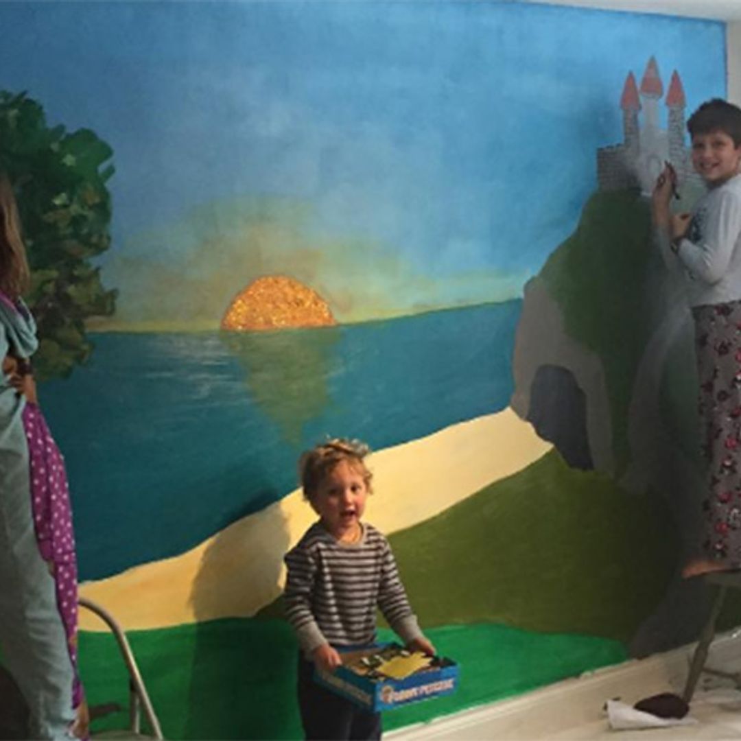 Justin Trudeau helps children paint house mural