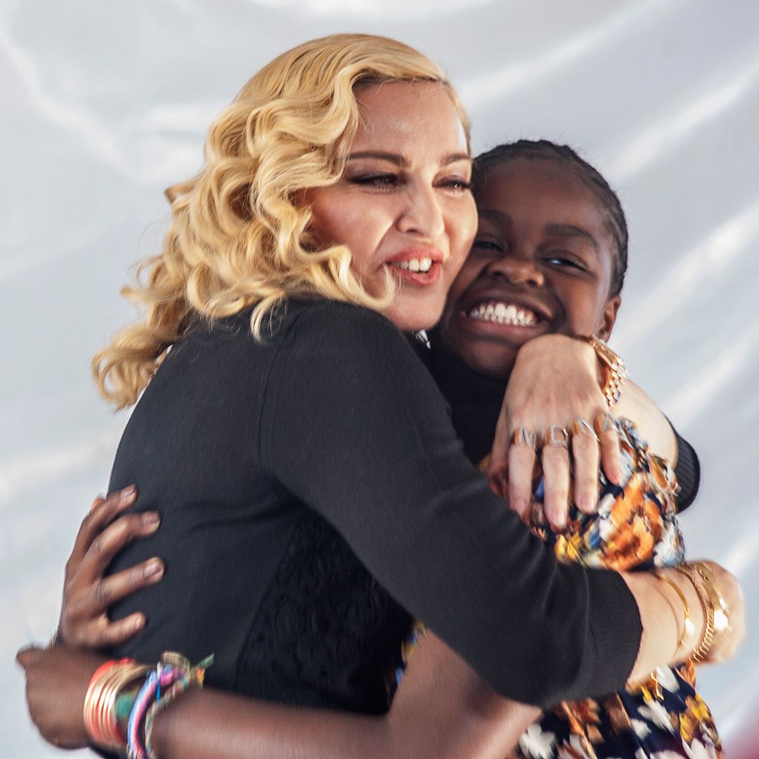 Madonna and Mercy hugging and smiling