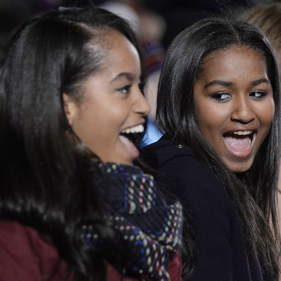 Malia and Sasha Obama are glowing as they enjoy daddy daughter date night with Barack