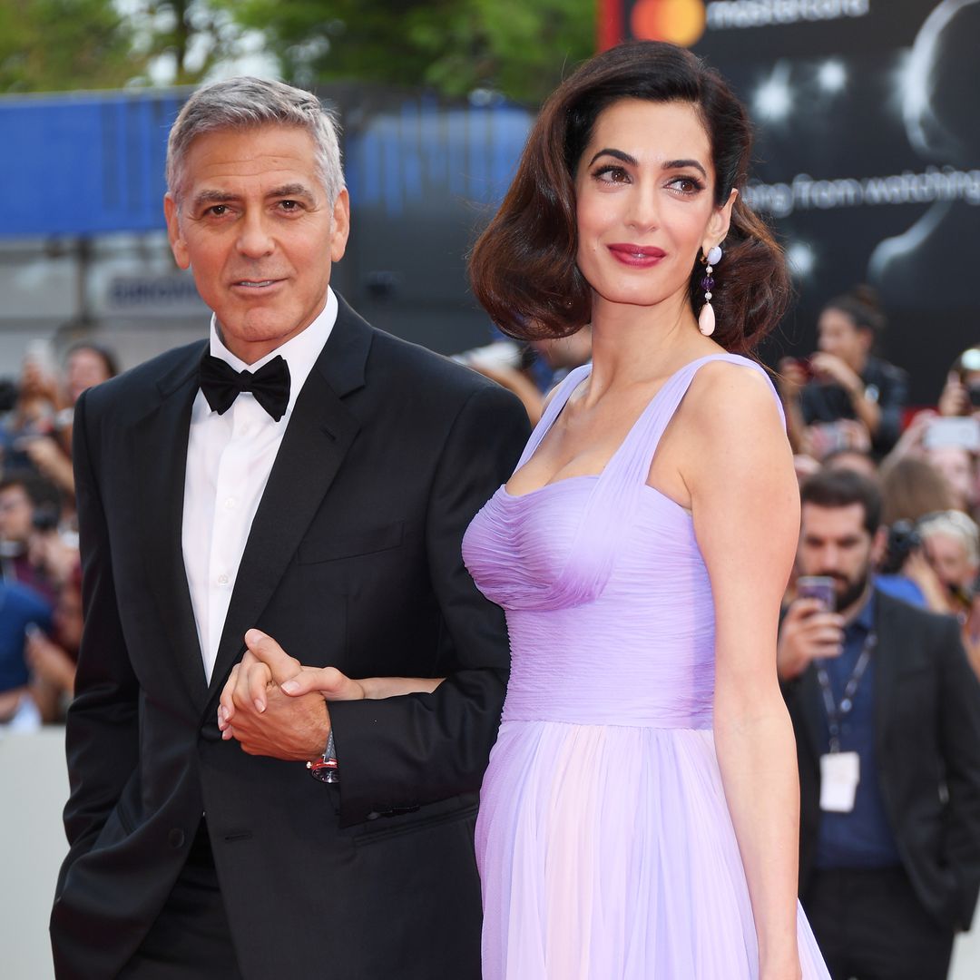 George and Amal Clooney's seven-year-old twins twins steal the limelight from famous dad