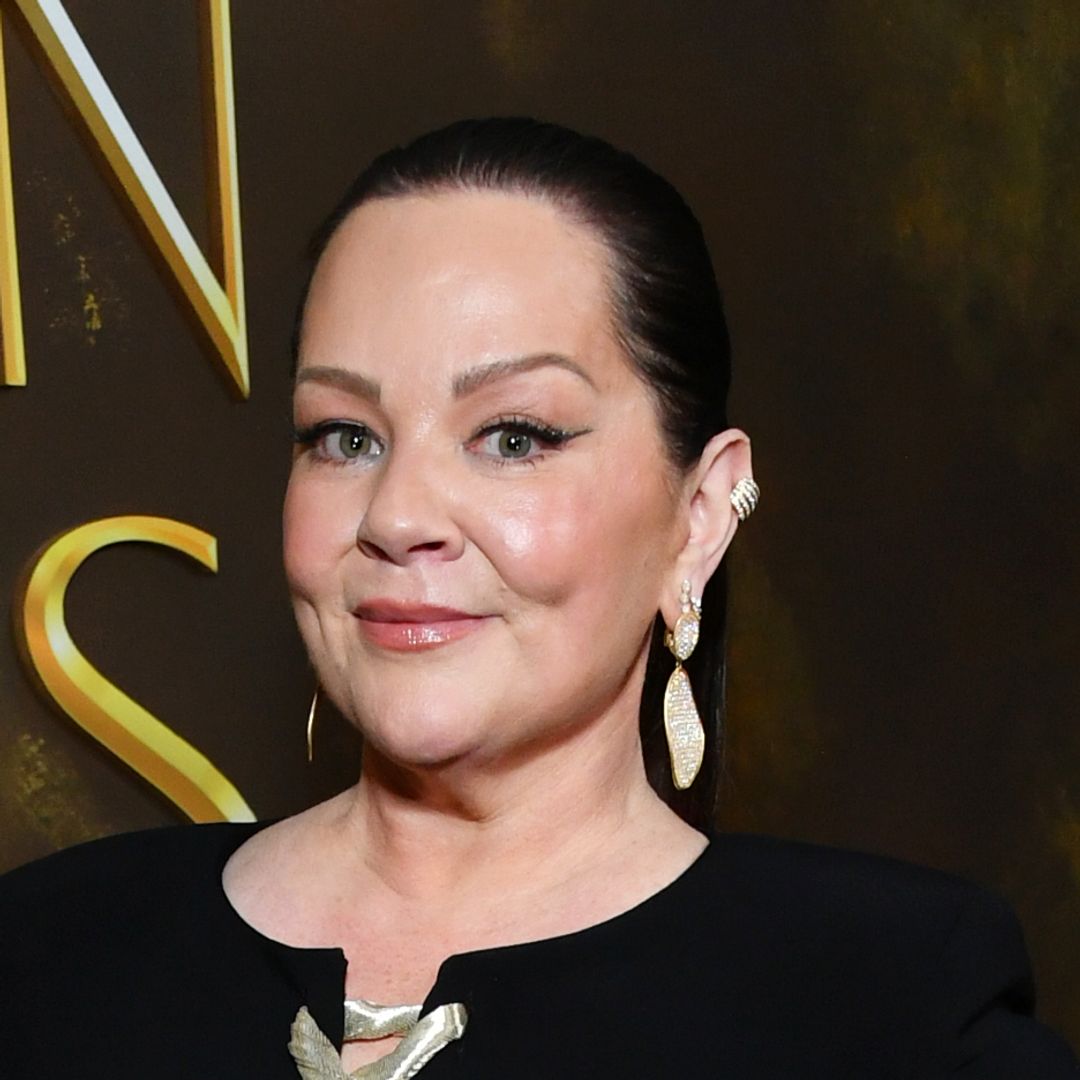 Melissa McCarthy looks incredible in curve-skimming gown and sleek ponytail for Golden Globes