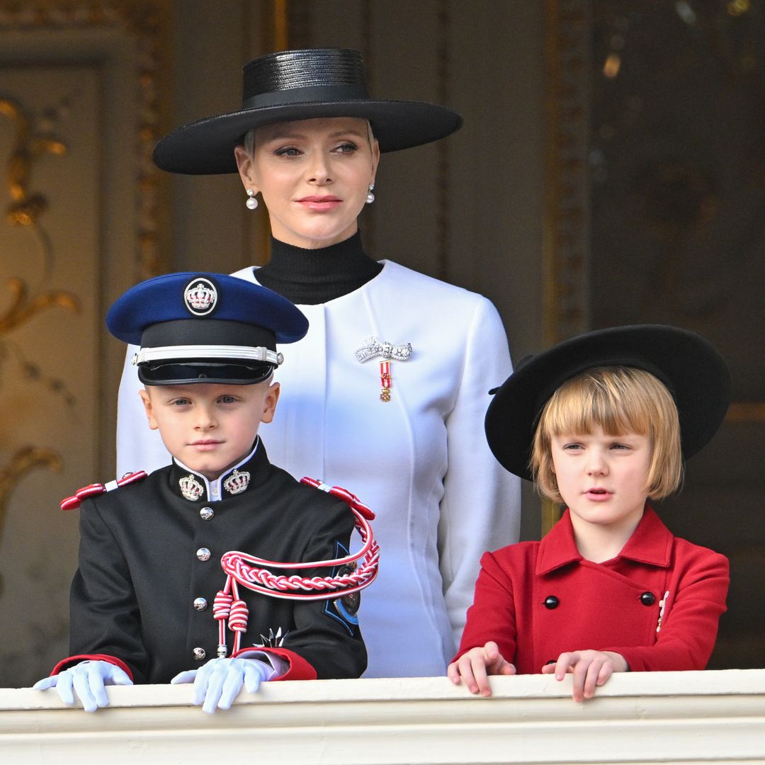 Princess Charlene twins with daughter Princess Gabriella next to massive 6-tier cake