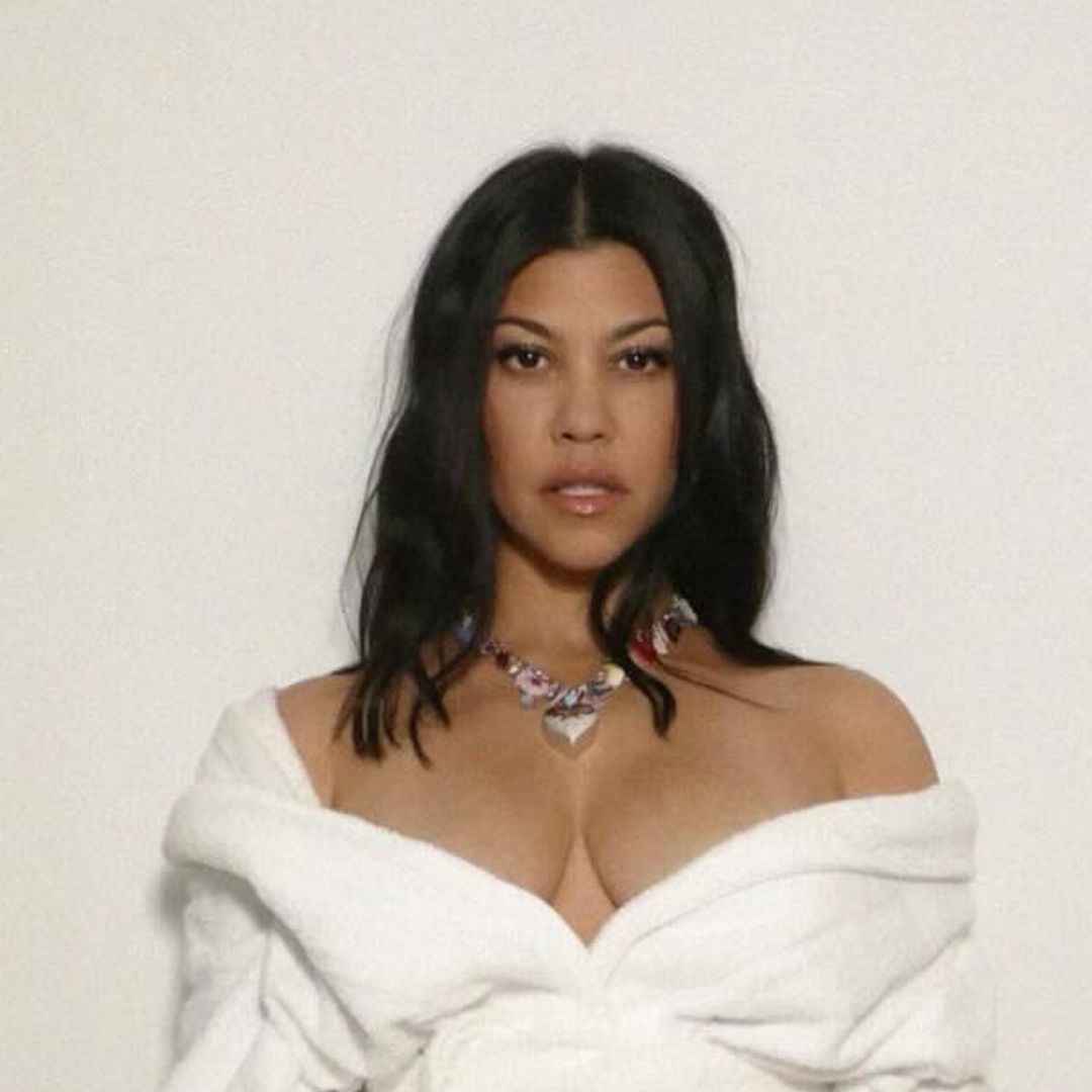 Kourtney Kardashian causes a stir in lingerie and fishnets for exciting announcement