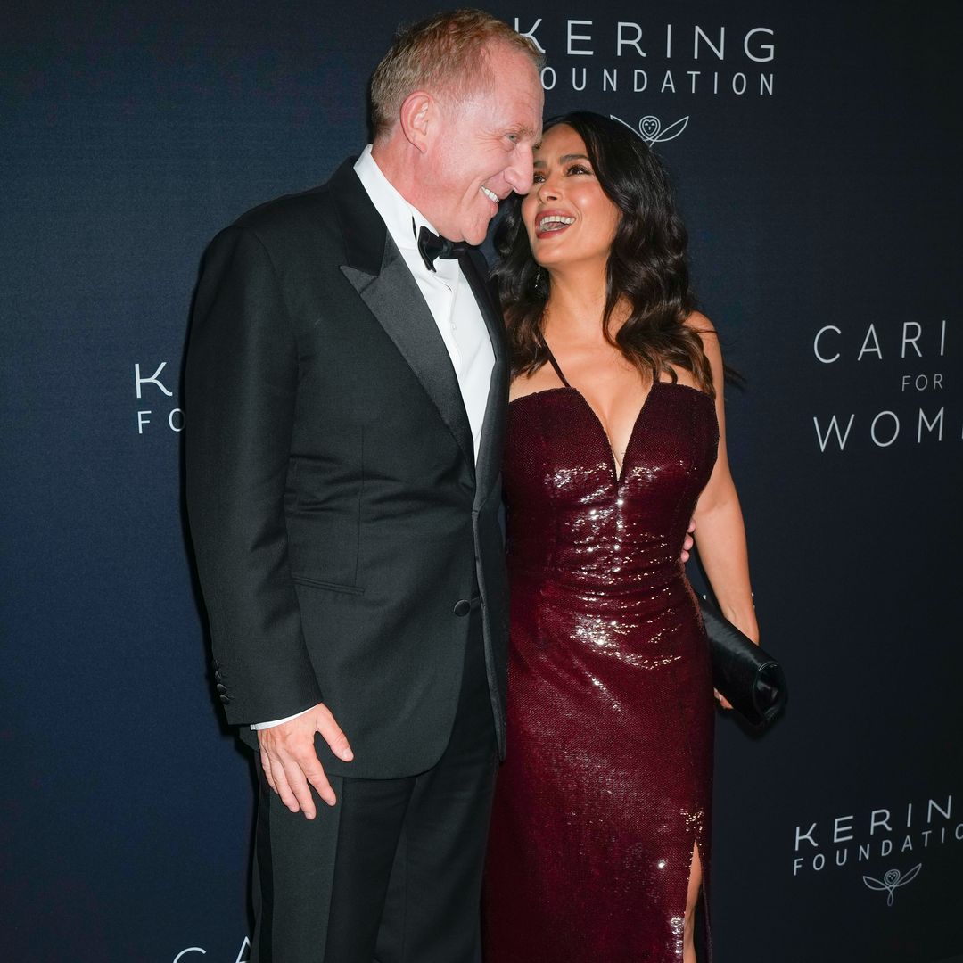Salma Hayek rocks plunging sequin dress - and her husband can't keep his hands off her