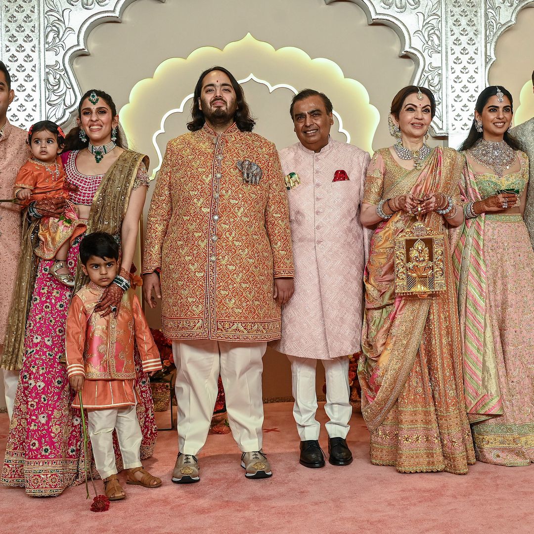 Billionaire tycoon and Chairman of Reliance Industries Mukesh Ambani (C) with his wife Nita Ambani (3R), daughter Isha Ambani (2R), sons Akash Ambani (L) and Anant Ambani (C, left), daughter-in-law Shloka Mehta (2L), and son-in-law Anand Piramal pose for photos as they arrive to attend the wedding ceremony of Anant and Radhika Merchant in Mumbai on July 12, 2024. Socialite sisters Kim and Khloe Kardashian were among the global celebrities spotted in India on July 12 to attend a lavish three-day wedding ceremony staged by Asia's richest man Mukesh Ambani. Ambani's youngest son Anant and fiancee Radhika Merchant, both 29, will tie the knot over the weekend in the financial capital Mumbai following months of pre-marriage parties that have set a new benchmark in matrimonial extravagance