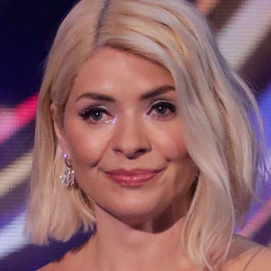 Holly Willoughby surprises in thigh-split sequin dress and feathers – and wow