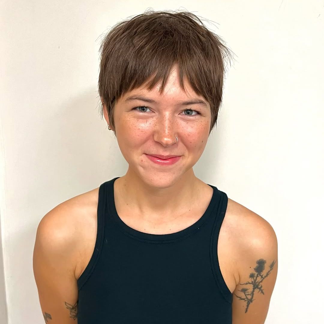 Eric Clapton's daughter Julie Clapton poses for a photo after getting a haircut, shared on Instagram