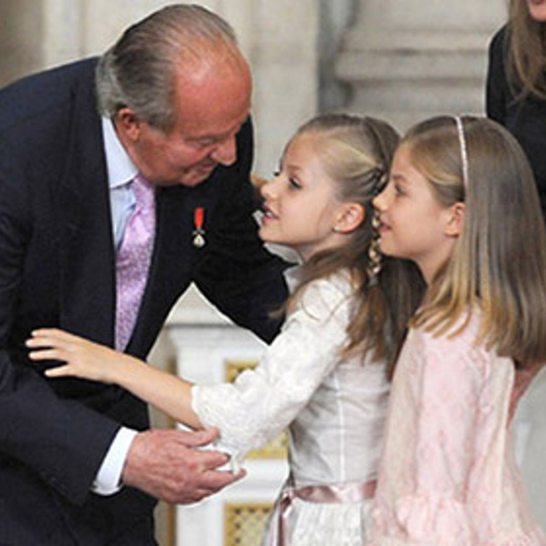 King Juan Carlos gives granddaughters kiss on the cheek each as he abdicates from Spanish throne