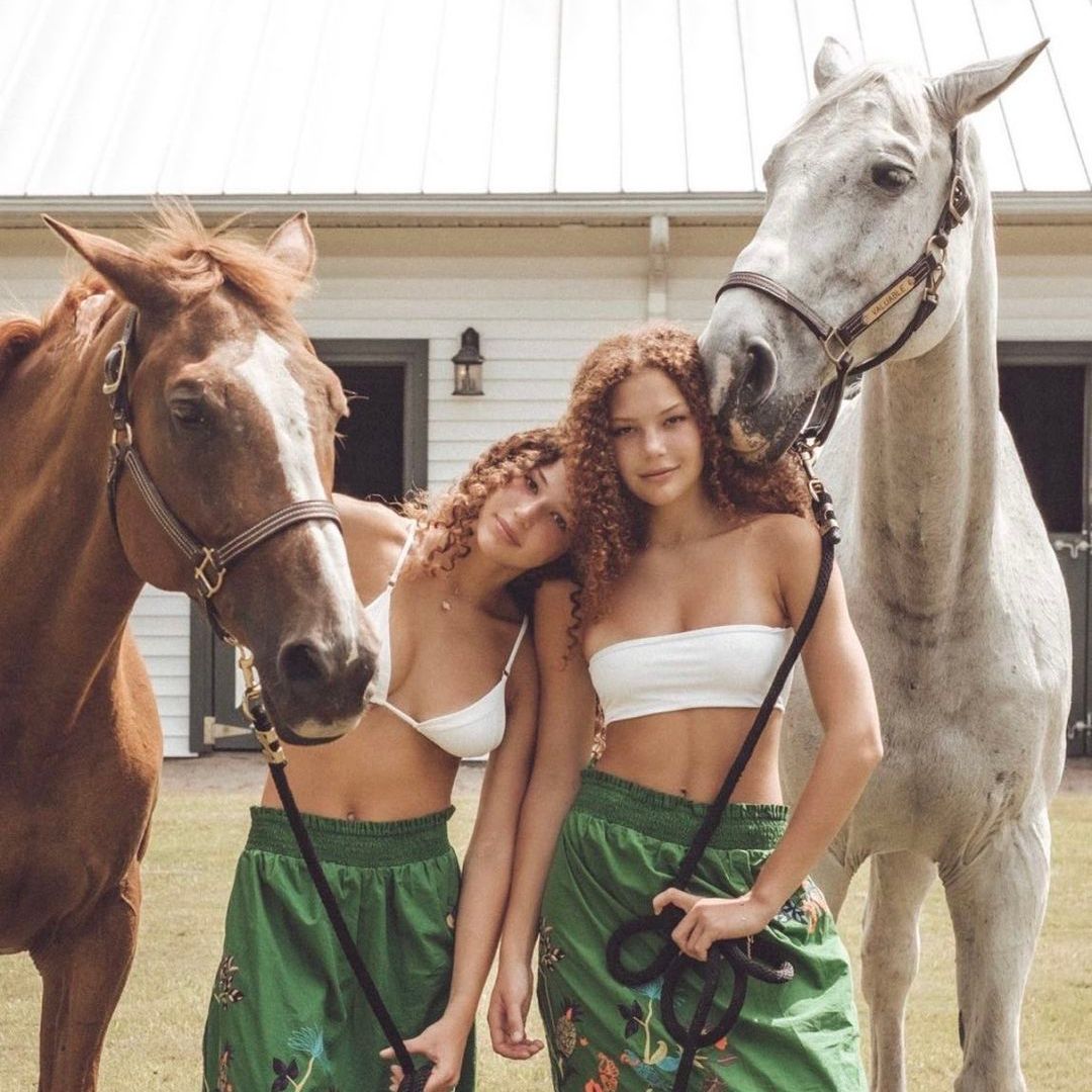 Isabella and Sophia Strahan pose with their horses on their mom Jean Muggli's farm, shared on Instagram