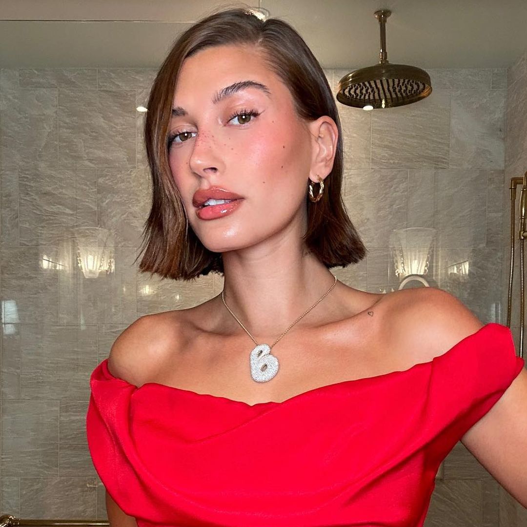 Hailey Bieber rocks lace lingerie and platform knee-high boots for a Parisian date-night