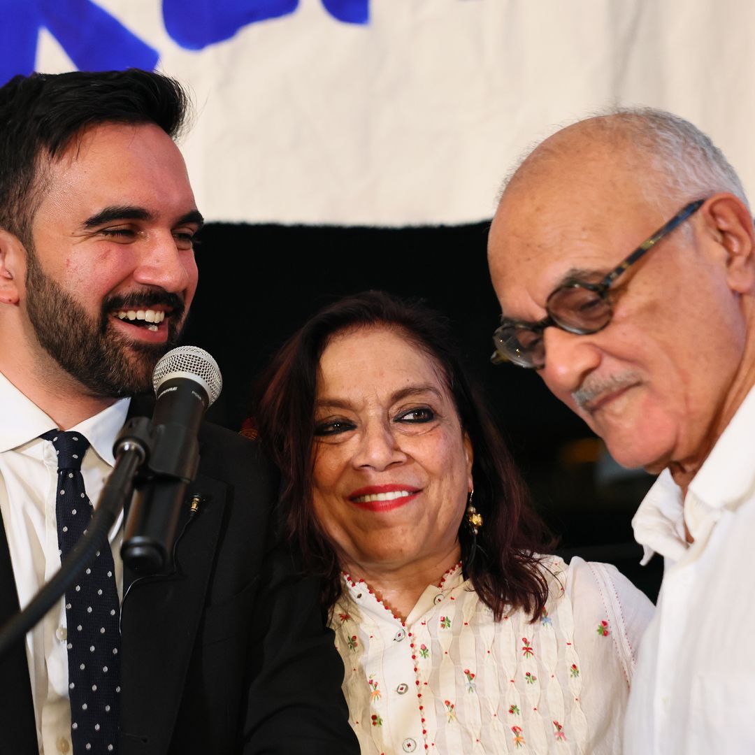 New York mayoral candidate, State Rep. Zohran Mamdani (D-NY) stands with his mother Mira Nair, and father Mahmood Mamdani as they celebrate during an election night gathering at The Greats of Craft LIC on June 24, 2025 in the Long Island City neighborhood of the Queens borough in New York City. Mamdani was announced as the winner of the Democratic nomination for mayor in a crowded field in the Cityâs mayoral primary to choose a successor to Mayor Eric Adams, who is running for re-election on an independent ticket