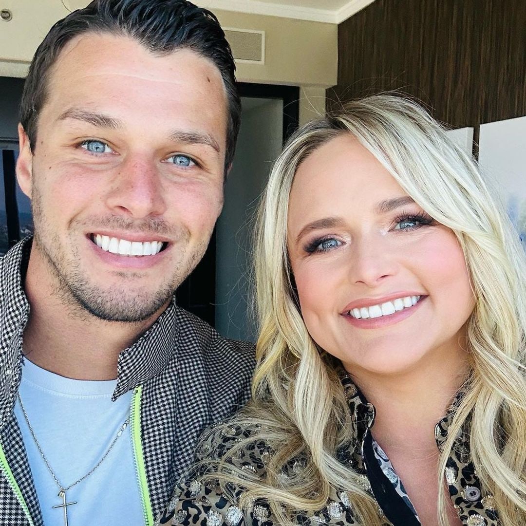 Miranda and Brendan smiling in a hotel room selfie
