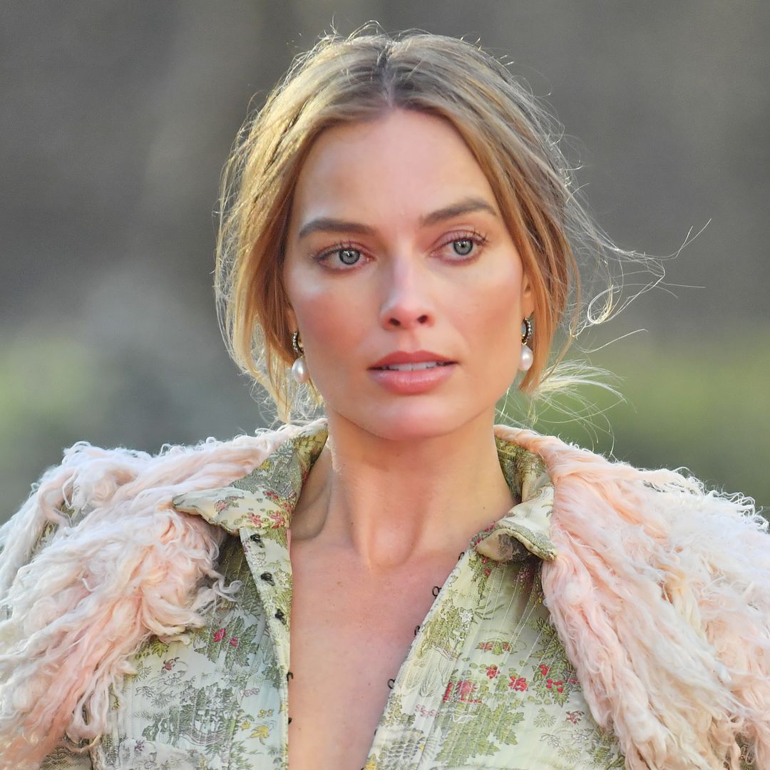 Margot Robbie braves the UK weather in 'naked' corset - and it's her most risqué look yet