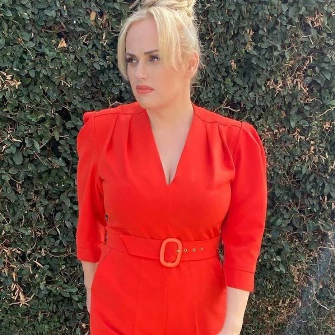 Rebel Wilson wows in a flatter-figuring red jumpsuit you need to see to believe