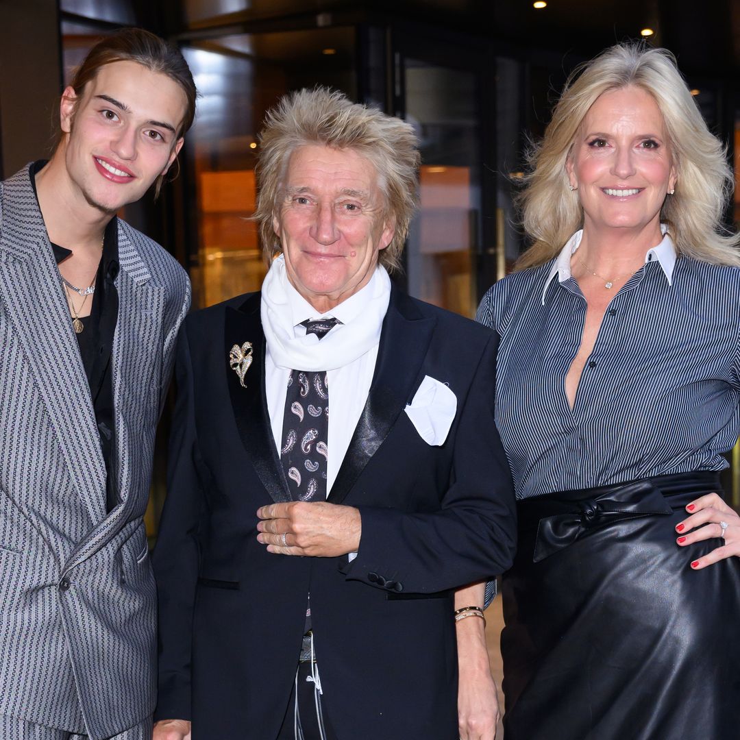 Rod Stewart and Penny Lancaster pose with model son Alastair, 18 - and he's so tall