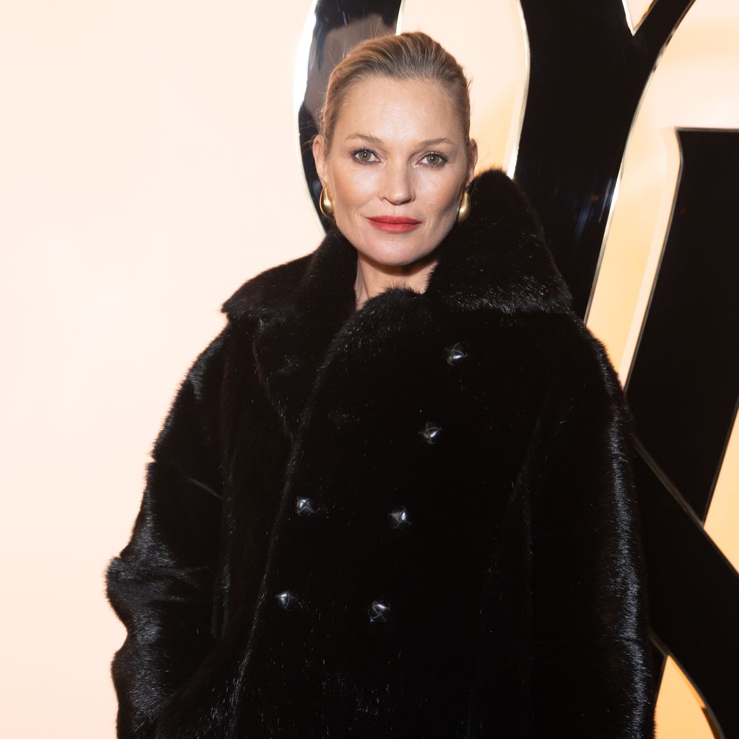 Kate Moss stuns in sheer tights and leather shorts at Paris Fashion Week