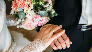 newlyweds-holding-hands