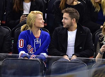 Margot Robbie and Tom Ackerley at a Football game.