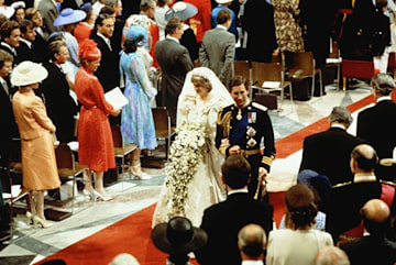 Prince Charles and Princess Diana walking down the aisle
