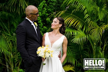 Jay Blades and Lisa Zbozen admire each other in wedding photo