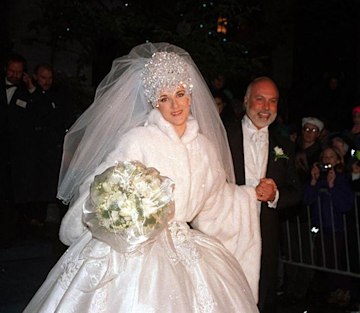 Bride Celine Dion wearing her princess wedding dress alongside Rene