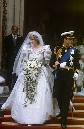 Princess Diana and Prince Charles walking arm in arm on their wedding day