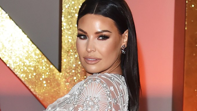 jess wright on the red carpet wearing white embellished dress