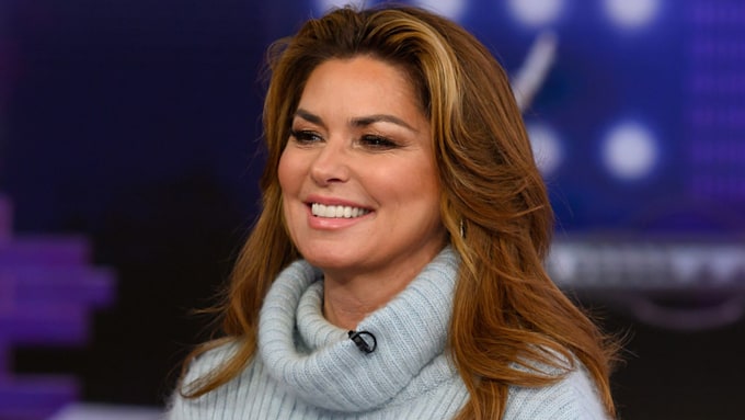 shania twain in blue rollneck knit