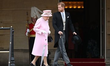 Prince Harry walking alongside the Queen