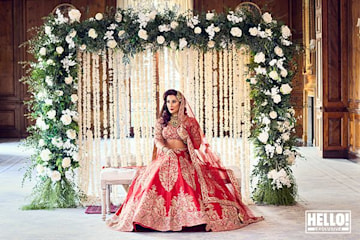 TrivDaily - Exclusive: Saira Khan becomes perfect South Asian bride as she talks vow renewal plans 54 Saira Khan poses in traditional outfit with rose arch behind her