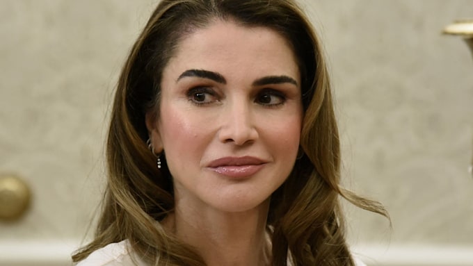 Queen Rania looking glamorous dressed in white 