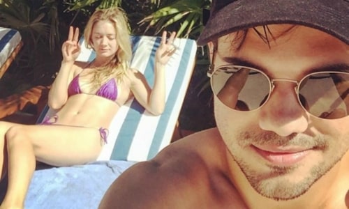 Billie Lourd jets away for a 'peaceful' holiday with Taylor Lautner after family deaths