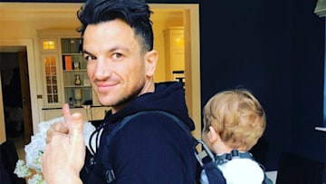 Peter Andre carrying baby Theo