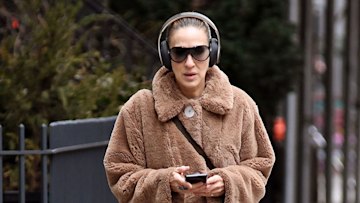 Sarah Jessica Parker wearing teddy coat and headphones
