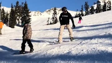 David and Cruz Beckham snowboarding 