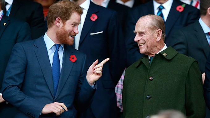 Prince Philip laughing with Prince Harry