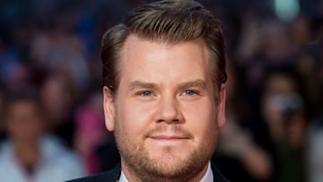 james corden poses on red carpet