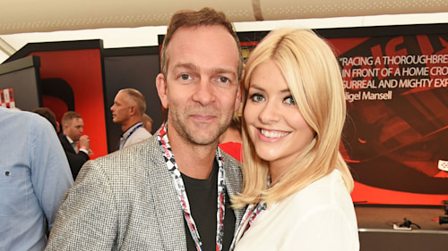 Holly Willoughby cuddles up to husband Dan Baldwin on lunch date in rare photo