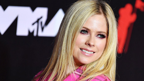 Avril Lavigne seriously turns up heat in tiny denim shorts and crop top