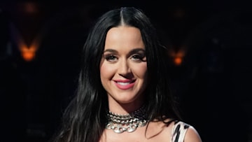 Katy Perry wows in form-fitting white swimsuit during nail-biting ...