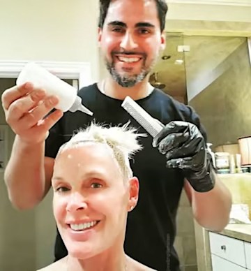 Brigitte Nielson wows in string bikini in candid beach selfie - sparks