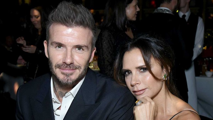 David and Victoria Beckham twin AGAIN - but this time in bold red ...
