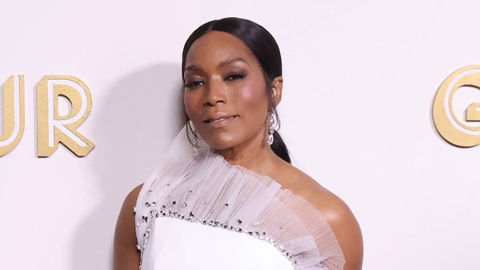 9-1-1's Angela Bassett dons plunging blazer during difficult appearance ...